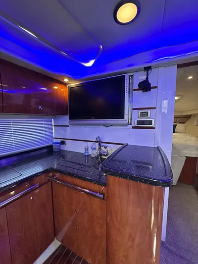 Zincohvid Yacht Photos Pics Luxurious 2008 Four Winns V458 yacht interior with modern kitchen and ambient lighting.