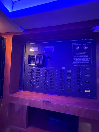 Zincohvid Yacht Photos Pics Electrical panel on 2008 Four Winns V458 boat, illuminated by blue lighting.
