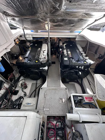Zincohvid Yacht Photos Pics Engine room of a 2008 Four Winns V458 boat, featuring dual engines and mechanical components.