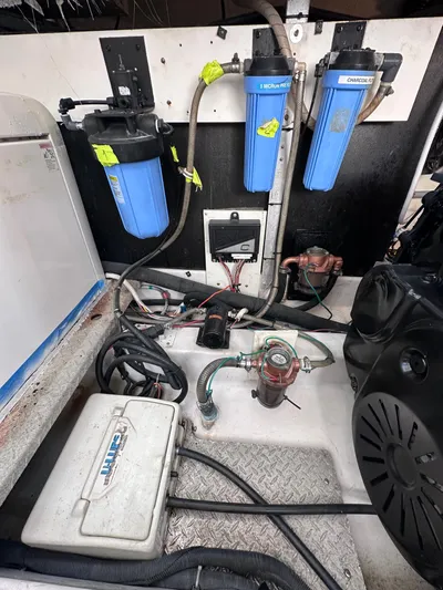 Zincohvid Yacht Photos Pics Engine room of a 2008 Four Winns V458 boat with water filtration system.