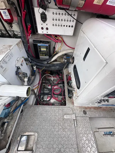 Zincohvid Yacht Photos Pics Engine compartment of a 2008 Four Winns V458 boat, showing wiring and equipment.