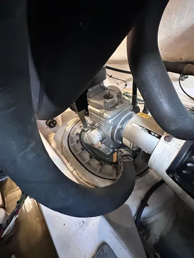 Zincohvid Yacht Photos Pics Engine compartment of a 2008 Four Winns V458 boat, showing mechanical components and hoses.