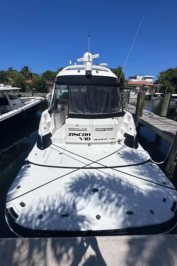 Zincohvid Yacht Photos Pics 2008 Four Winns V458 yacht docked, rear view, sunny day, marina setting.