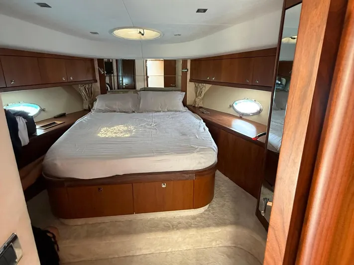  Yacht Photos Pics Luxurious bedroom interior of 2008 Sunseeker Manhattan 60 yacht with elegant wood finish.