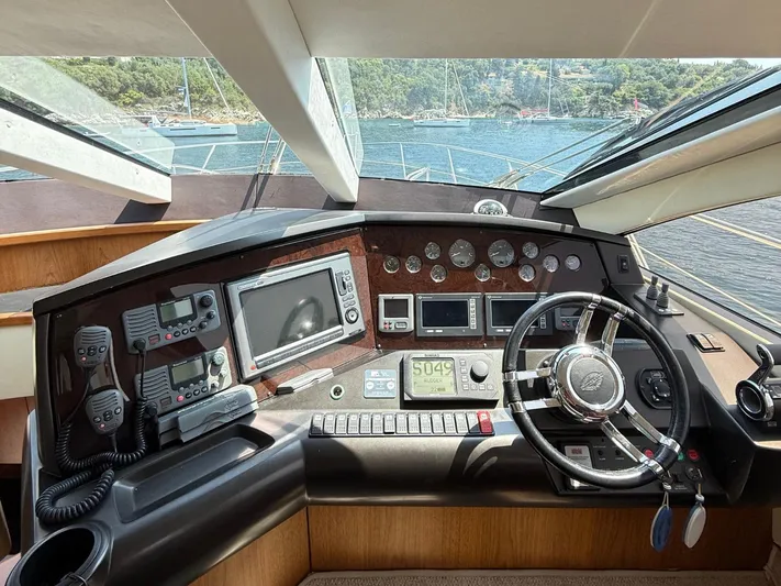  Yacht Photos Pics Cockpit of 2008 Sunseeker Manhattan 60 yacht with navigation instruments and steering wheel.
