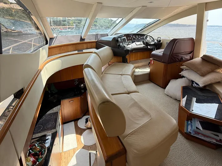  Yacht Photos Pics Luxurious interior of 2008 Sunseeker Manhattan 60 yacht with leather seating and panoramic windows.