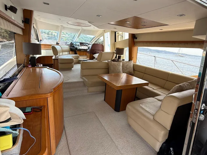  Yacht Photos Pics Luxurious interior of 2008 Sunseeker Manhattan 60 yacht with beige seating and wooden accents.