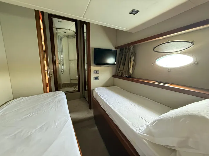  Yacht Photos Pics Interior cabin of 2008 Sunseeker Manhattan 60 yacht with twin beds and ensuite bathroom.