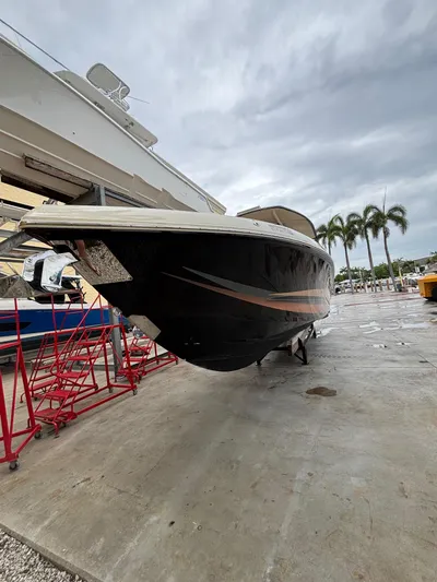  Yacht Photos Pics 2013 Statement 35 Center Console boat on dry dock with overcast sky.