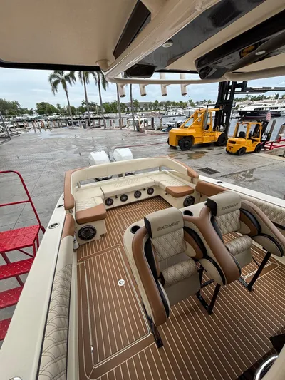  Yacht Photos Pics 2013 Statement 35 Center Console boat with luxurious seating at a marina.