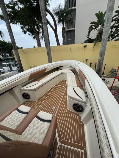  Yacht Photos Pics 2013 Statement 35 Center Console boat with luxurious seating and teak flooring.