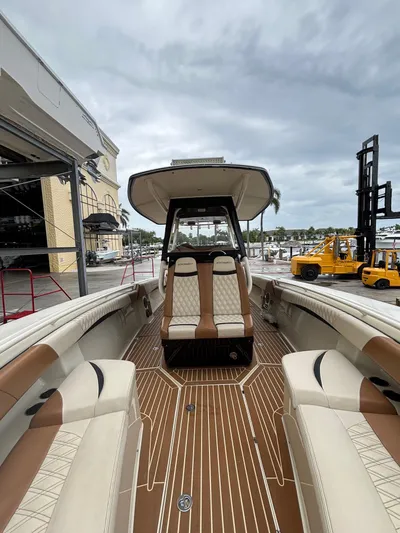  Yacht Photos Pics 2013 Statement 35 Center Console boat with luxurious seating and wood-patterned flooring.