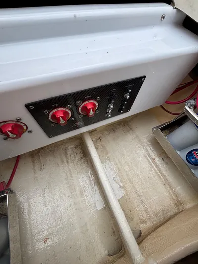  Yacht Photos Pics Control panel of 2013 Statement 35 Center Console boat with red switches and wiring.