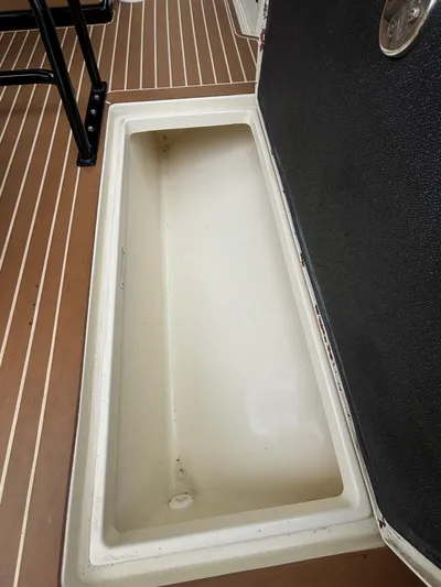  Yacht Photos Pics Open storage compartment on 2013 Statement 35 Center Console boat deck.