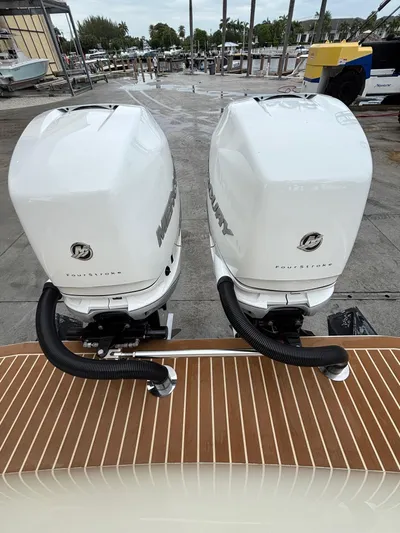  Yacht Photos Pics Twin Mercury FourStroke engines on a 2013 Statement 35 Center Console boat.