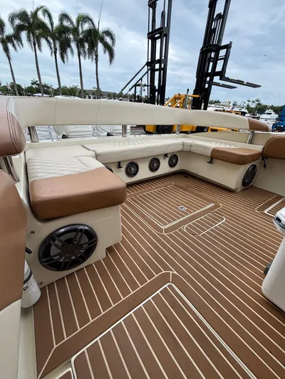  Yacht Photos Pics Luxurious 2013 Statement 35 Center Console boat interior with cushioned seating and speakers.