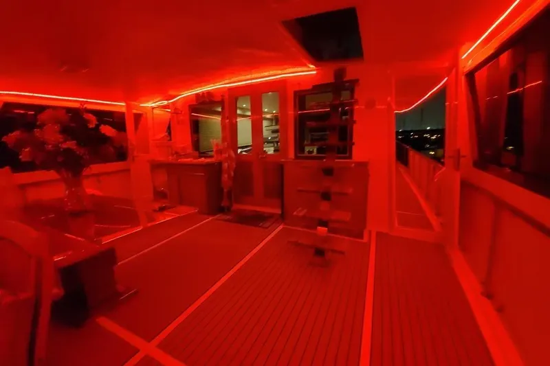  Yacht Photos Pics Interior of 1984 Hatteras 61 Cockpit MY yacht with red ambient lighting.