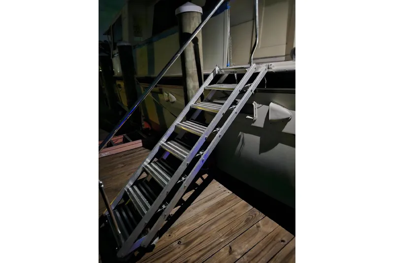  Yacht Photos Pics Staircase leading to 1984 Hatteras 61 Cockpit MY yacht at night.