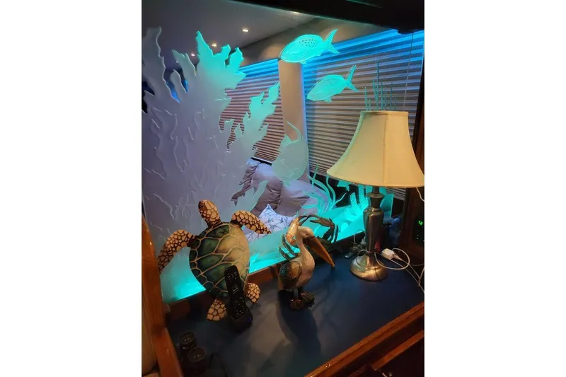  Yacht Photos Pics Decorative marine-themed interior with lamp and sculptures on Hatteras 61 Cockpit MY, 1984.