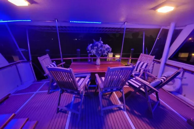 Yacht Photos Pics Luxurious 1984 Hatteras 61 Cockpit MY yacht deck with elegant seating and ambient lighting.