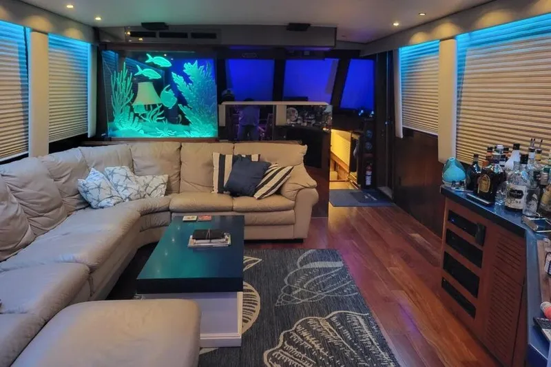  Yacht Photos Pics Luxurious interior of 1984 Hatteras 61 Cockpit MY with aquarium and bar setup.