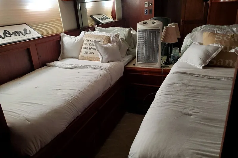  Yacht Photos Pics Cozy twin beds in 1984 Hatteras 61 Cockpit MY yacht cabin with heater and decor.