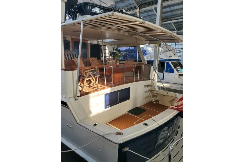  Yacht Photos Pics 1984 Hatteras 61 Cockpit MY yacht with spacious deck and elegant wooden furniture.