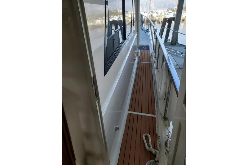  Yacht Photos Pics 1984 Hatteras 61 Cockpit MY yacht side deck with wooden flooring and railing.