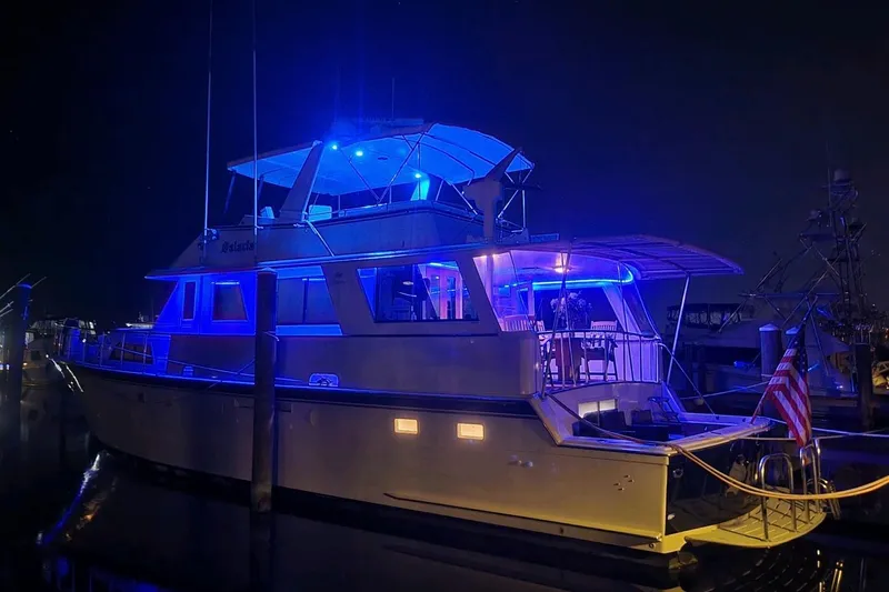  Yacht Photos Pics 1984 Hatteras 61 Cockpit MY yacht illuminated with blue lights at night.