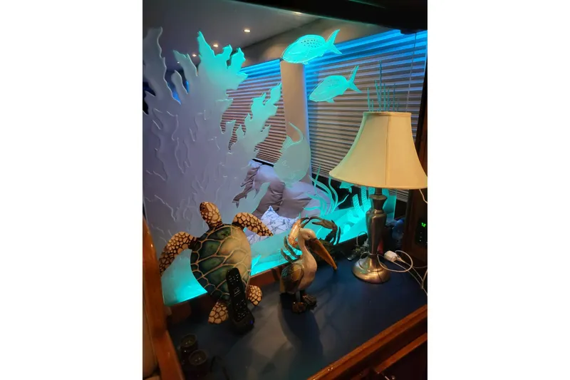  Yacht Photos Pics Decorative marine-themed interior with lamp and sculptures on 1984 Hatteras 61 Cockpit MY yacht.