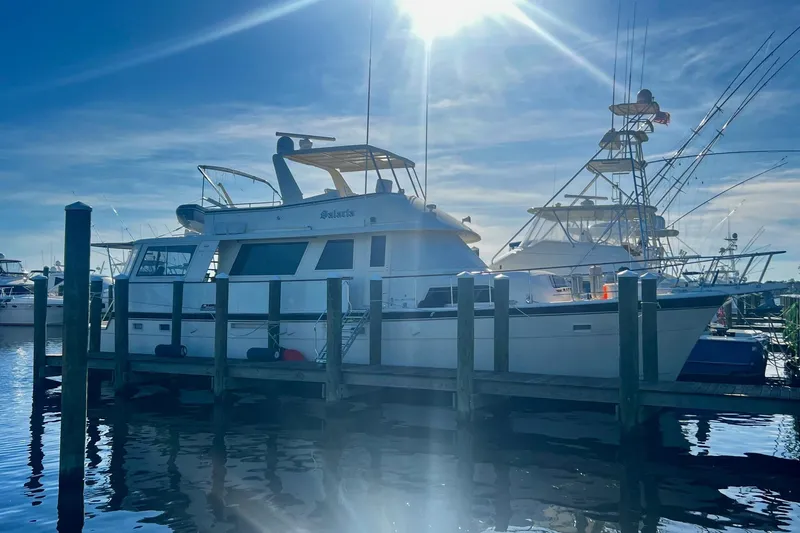  Yacht Photos Pics 1984 Hatteras 61 Cockpit MY yacht docked under bright sunlight.