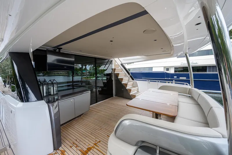 Escape Yacht Photos Pics Luxurious 2022 Princess Y85 Motor Yacht deck with seating and modern amenities.