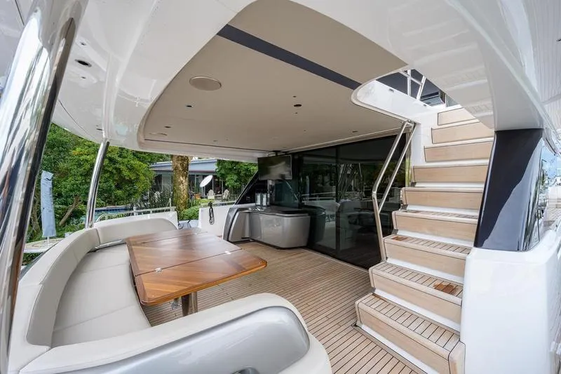 Escape Yacht Photos Pics Luxurious 2022 Princess Y85 Motor Yacht with elegant outdoor seating and staircase.