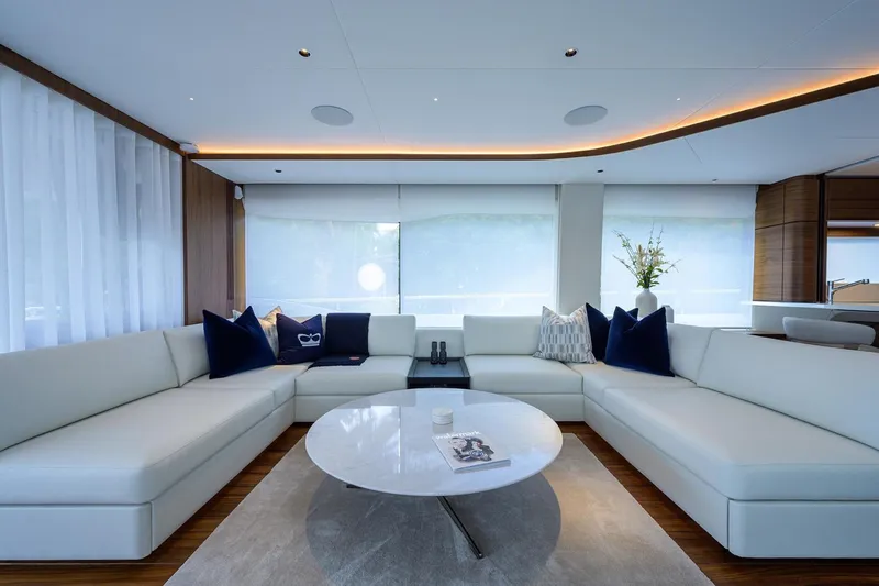 Escape Yacht Photos Pics Luxurious interior of 2022 Princess Y85 Motor Yacht with elegant white seating.