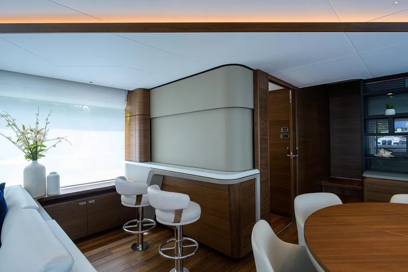 Escape Yacht Photos Pics Luxurious interior of 2022 Princess Y85 Motor Yacht with modern seating and elegant decor.