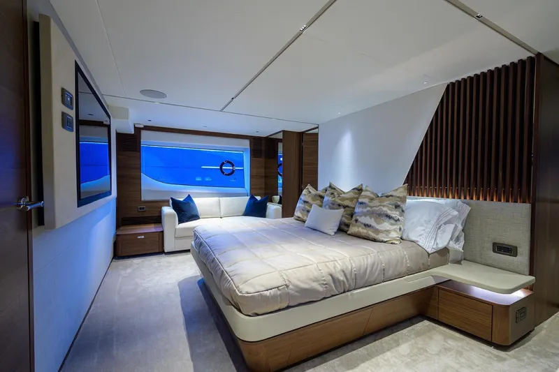 Escape Yacht Photos Pics Luxurious bedroom interior of 2022 Princess Y85 Motor Yacht with modern design and ocean view.