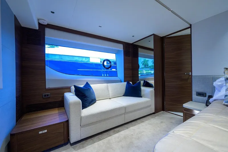 Escape Yacht Photos Pics Luxurious interior of 2022 Princess Y85 Motor Yacht with modern seating and large window.