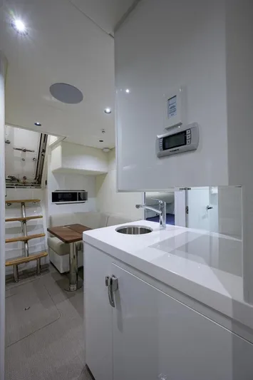 Escape Yacht Photos Pics Modern interior of 2022 Princess Y85 Motor Yacht with sleek white cabinetry.
