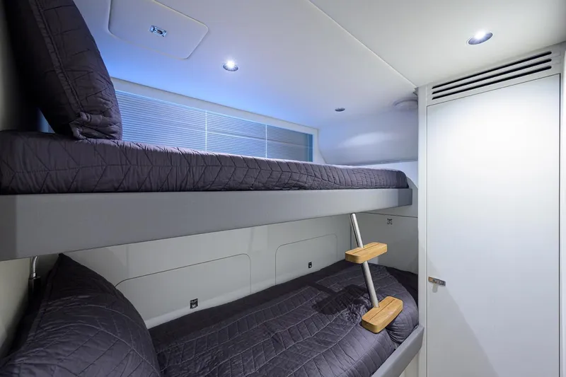 Escape Yacht Photos Pics Bunk beds in 2022 Princess Y85 Motor Yacht cabin, modern design with sleek lighting.