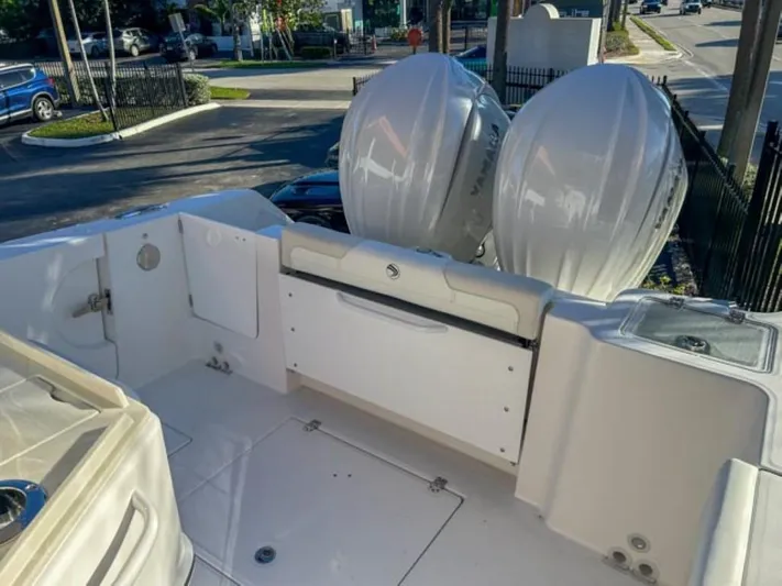  Yacht Photos Pics 2025 Edgewater 262CC boat deck with dual outboard motors.