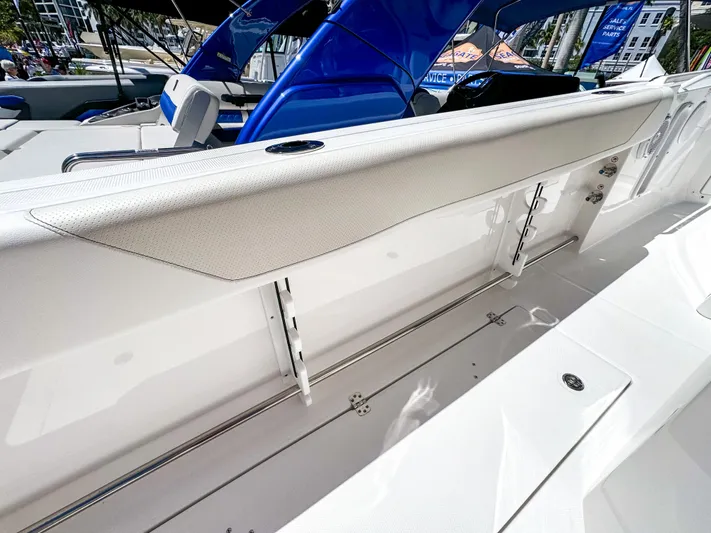  Yacht Photos Pics 2025 Edgewater 262CC boat interior with sleek white seating and modern design.