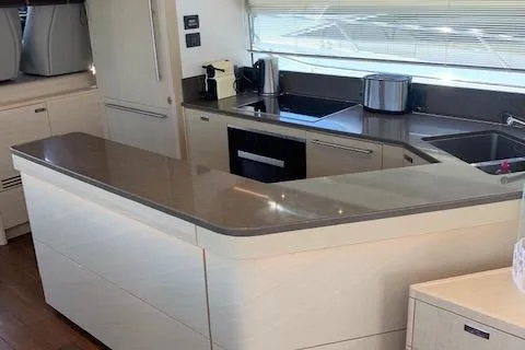  Yacht Photos Pics Modern kitchen interior on a 2018 Princess 75 yacht, featuring sleek countertops and appliances.