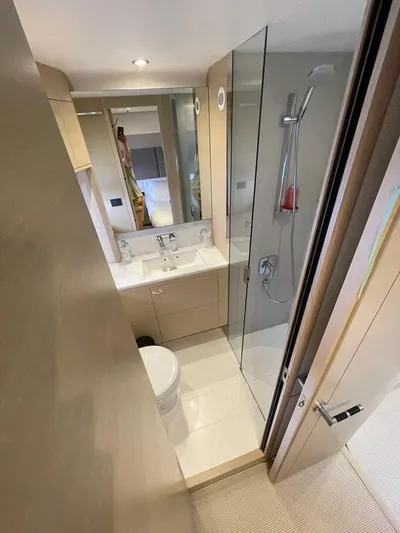  Yacht Photos Pics Luxurious bathroom in 2018 Princess 75 yacht with modern fixtures and glass shower.