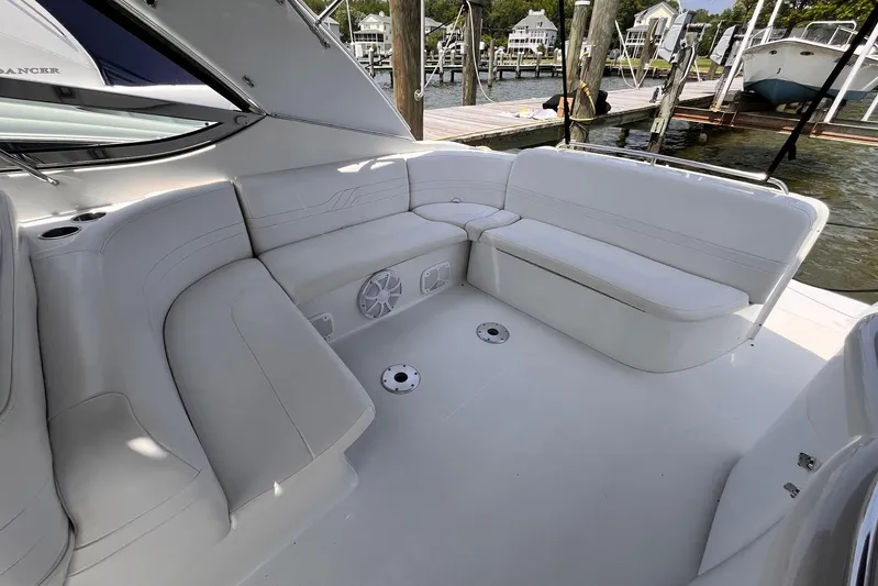 La Bella Vita Yacht Photos Pics Luxurious seating area on a 2003 Formula 400 Super Sport boat docked at a marina.