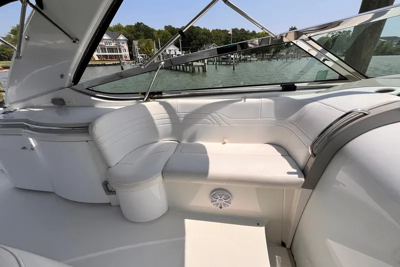La Bella Vita Yacht Photos Pics Luxurious seating area on a 2003 Formula 400 Super Sport boat, docked by waterfront homes.