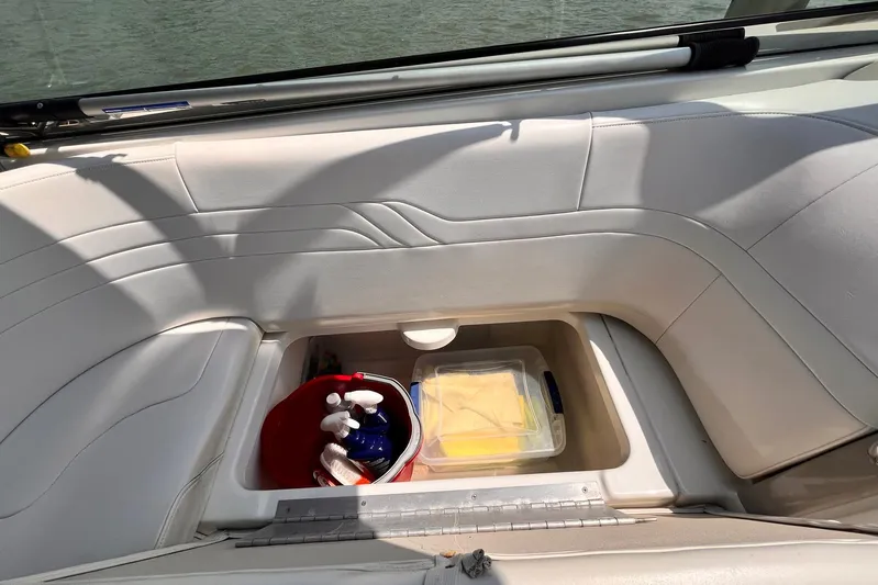 La Bella Vita Yacht Photos Pics Storage compartment on a 2003 Formula 400 Super Sport boat with cleaning supplies.