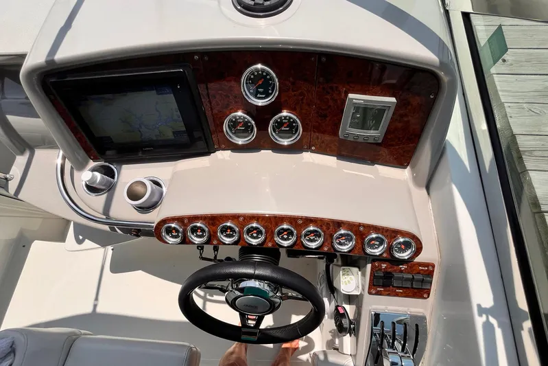 La Bella Vita Yacht Photos Pics Dashboard of a 2003 Formula 400 Super Sport boat with gauges and controls.