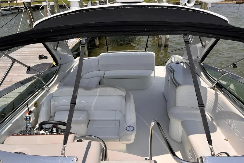 La Bella Vita Yacht Photos Pics 2003 Formula 400 Super Sport boat interior with white seating and black canopy.