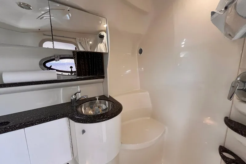 La Bella Vita Yacht Photos Pics Interior of 2003 Formula 400 Super Sport boat bathroom with sink and mirror.