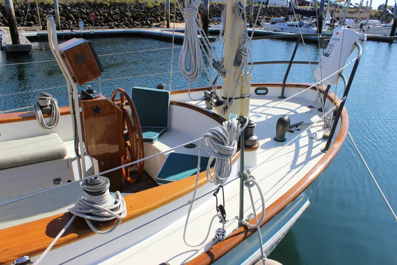 La Vie En Rose Yacht Photos Pics Sailboat "Gartside Jespersen 40" 2012 model, docked with wooden deck and steering wheel.